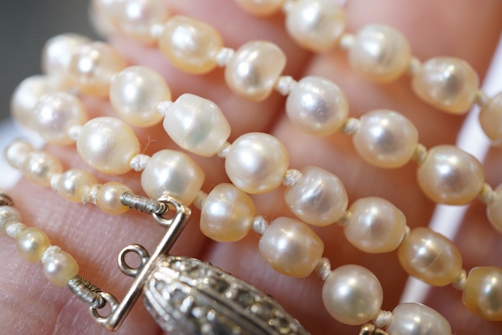 A natural pearl and diamond necklace, early 20th century